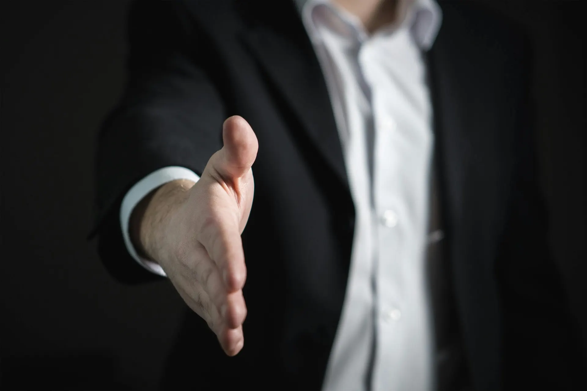 VisionSquare team member offering a handshake